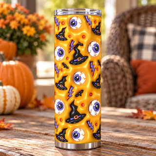 Eyeballs, witch hats and lightning on yellow — one tumbler in porch setting