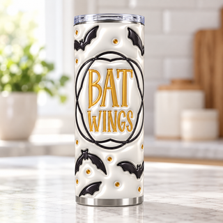 Bat Wings: black bats and gold lettering — single tumbler on kitchen counter