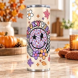 Spooky Vibes: leopard smiley and skeleton hand — one 20 oz skinny stainless steel tumbler in a kitchen lifestyle mockup